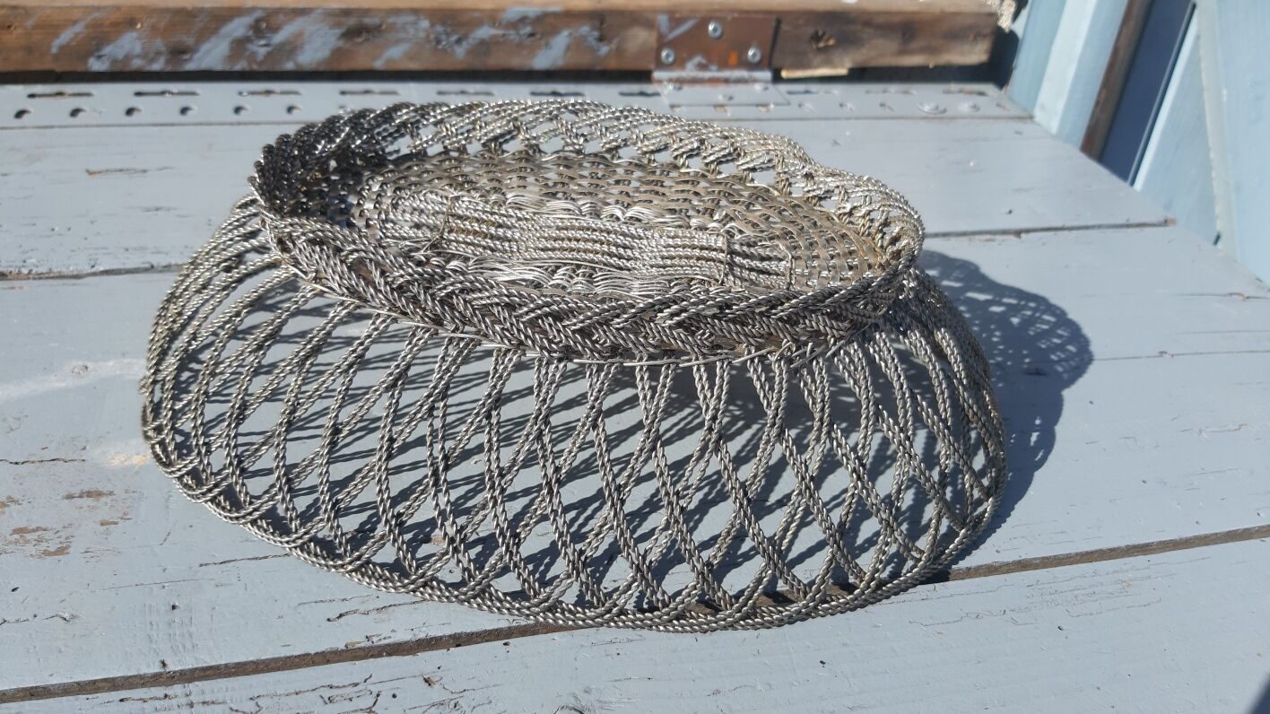 flat basket cut center table in woven metal