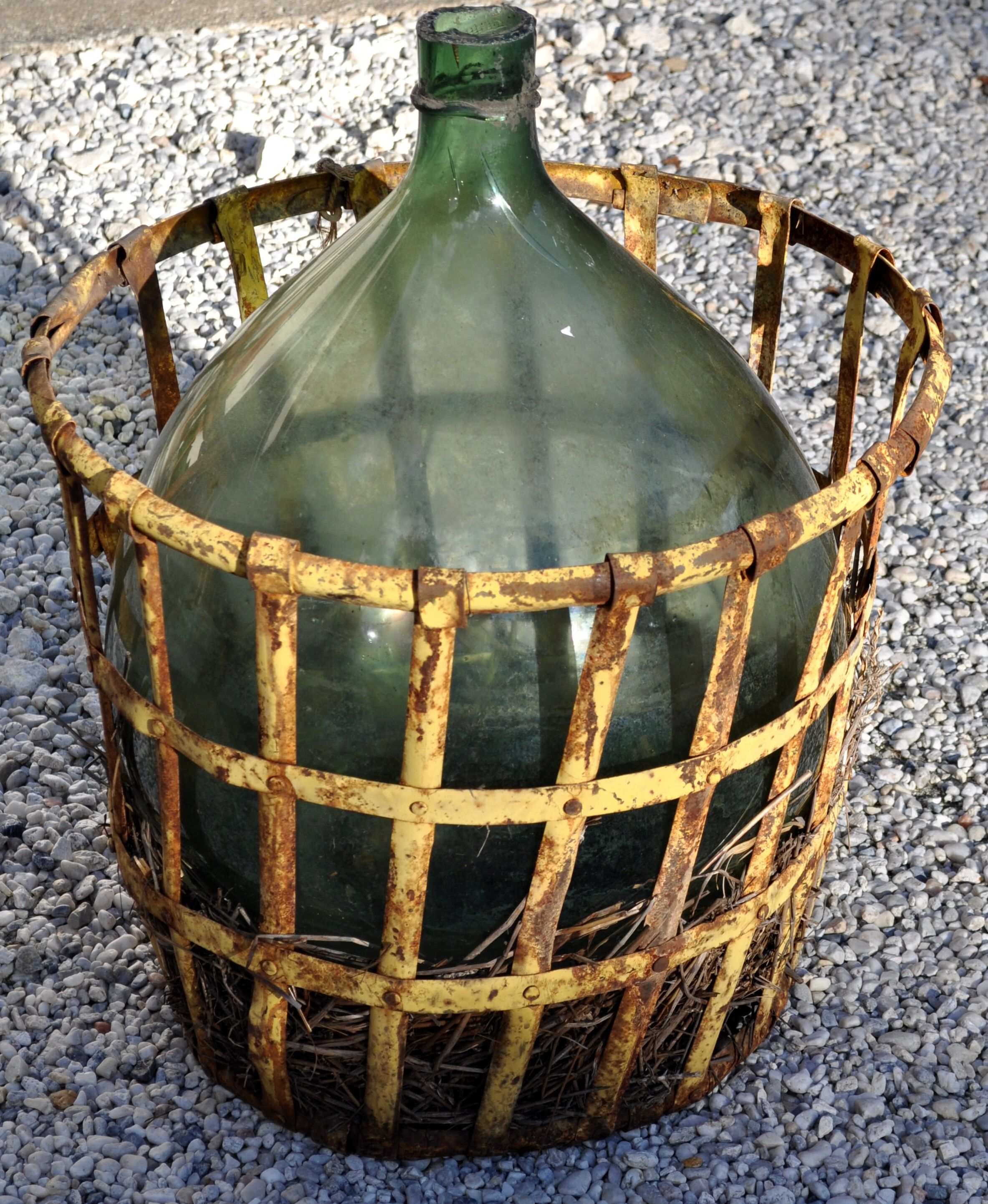 Demijohn in his iron cager