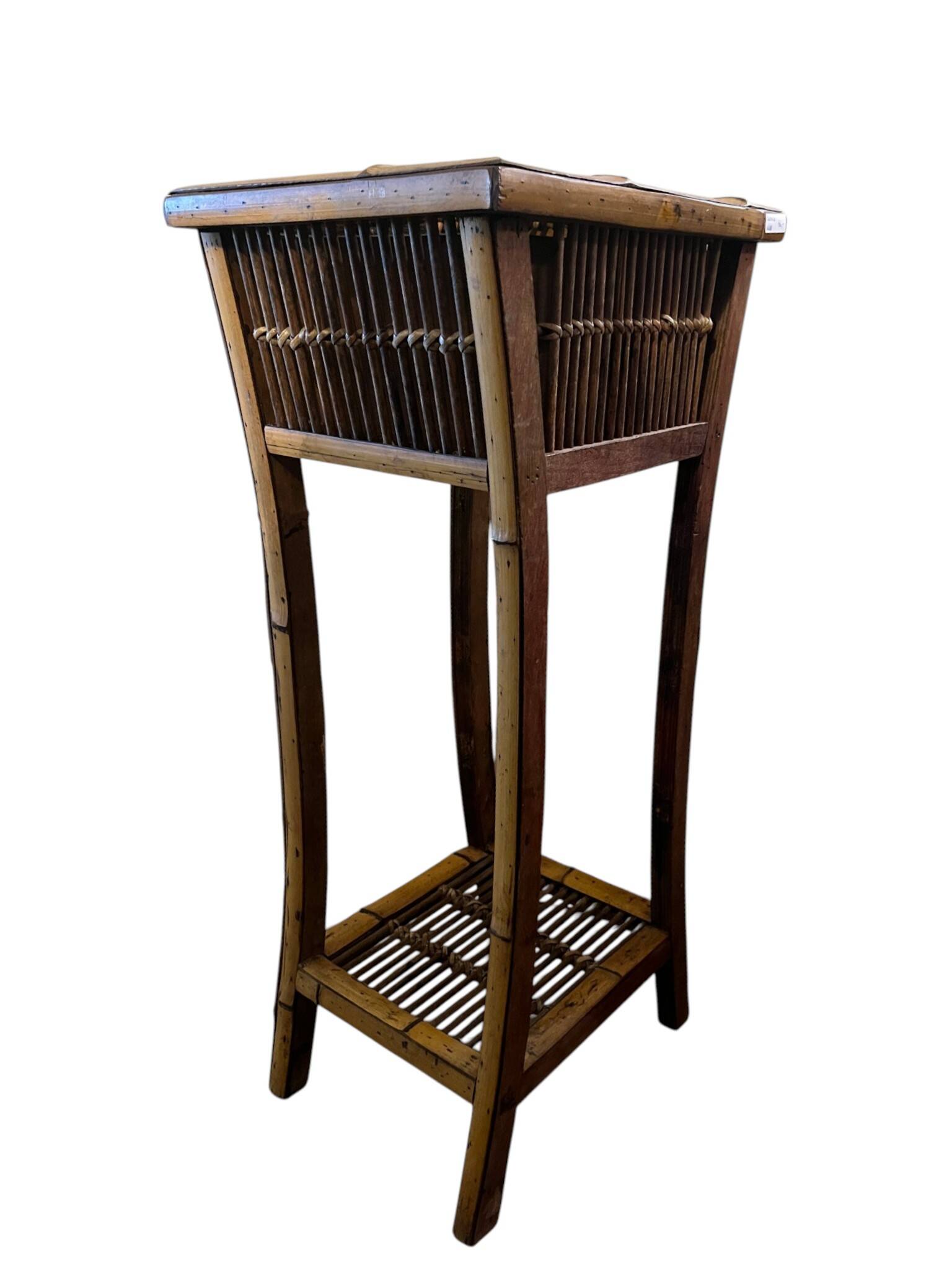 Vintage bamboo side table with drawer from the 20th century.