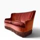 Vintage two-seater armchair in powder pink velvet with fringes.