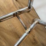 4 chrome chairs with green and white checkered tiles