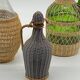 Trio bottles / lady Jeanne, dressed in wicker, rattan, natural fibers