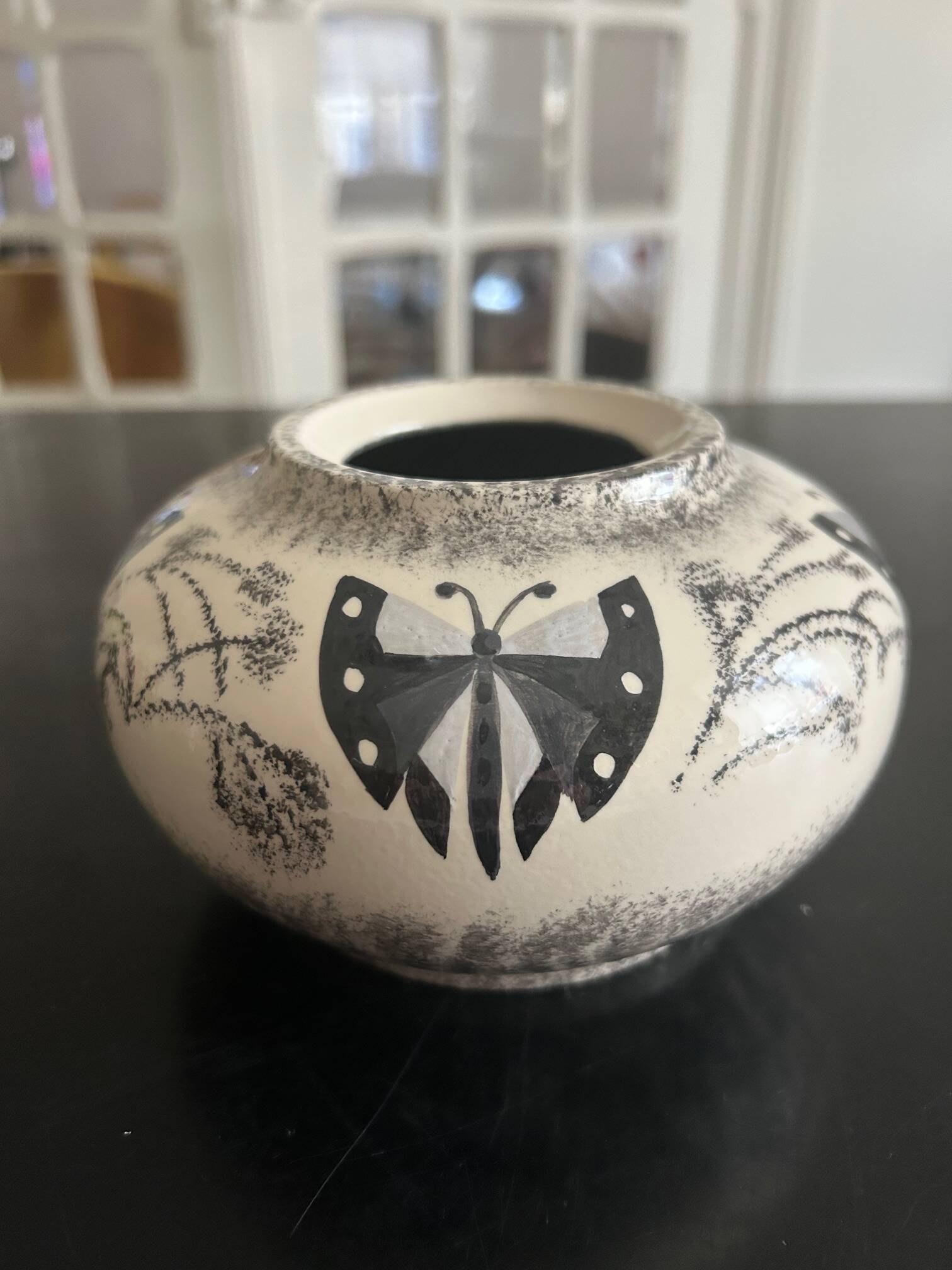 ceramic vase decorated by the artist René Poirot