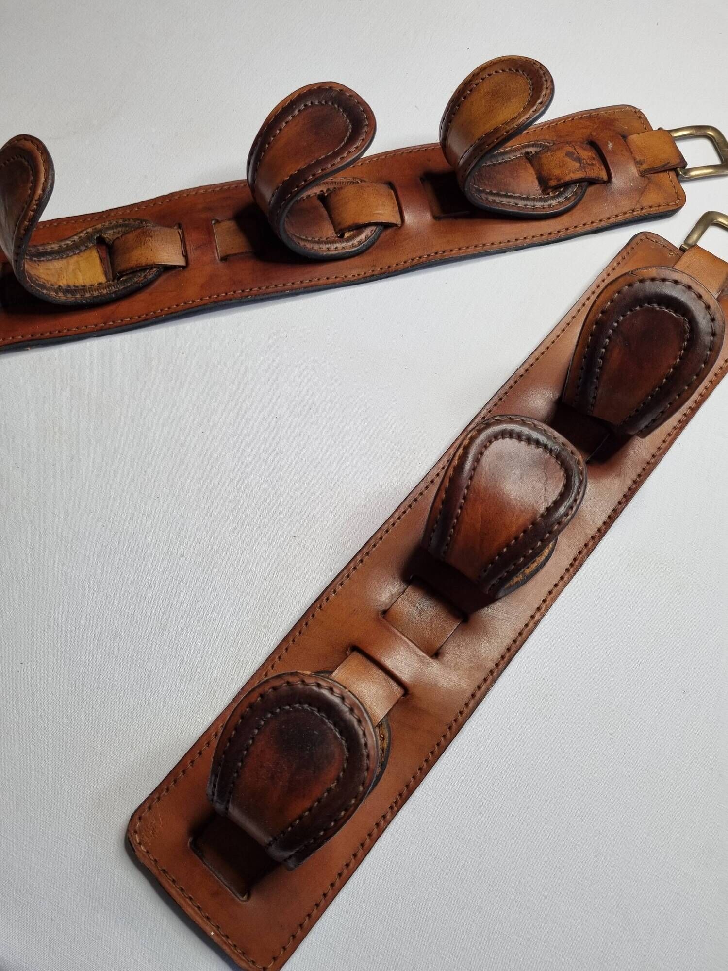 Pair of game bags in saddle leather and brass, old, 3 hooks, 57 cm