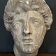 Antique plaster sculpture of a female face from the early 20th century