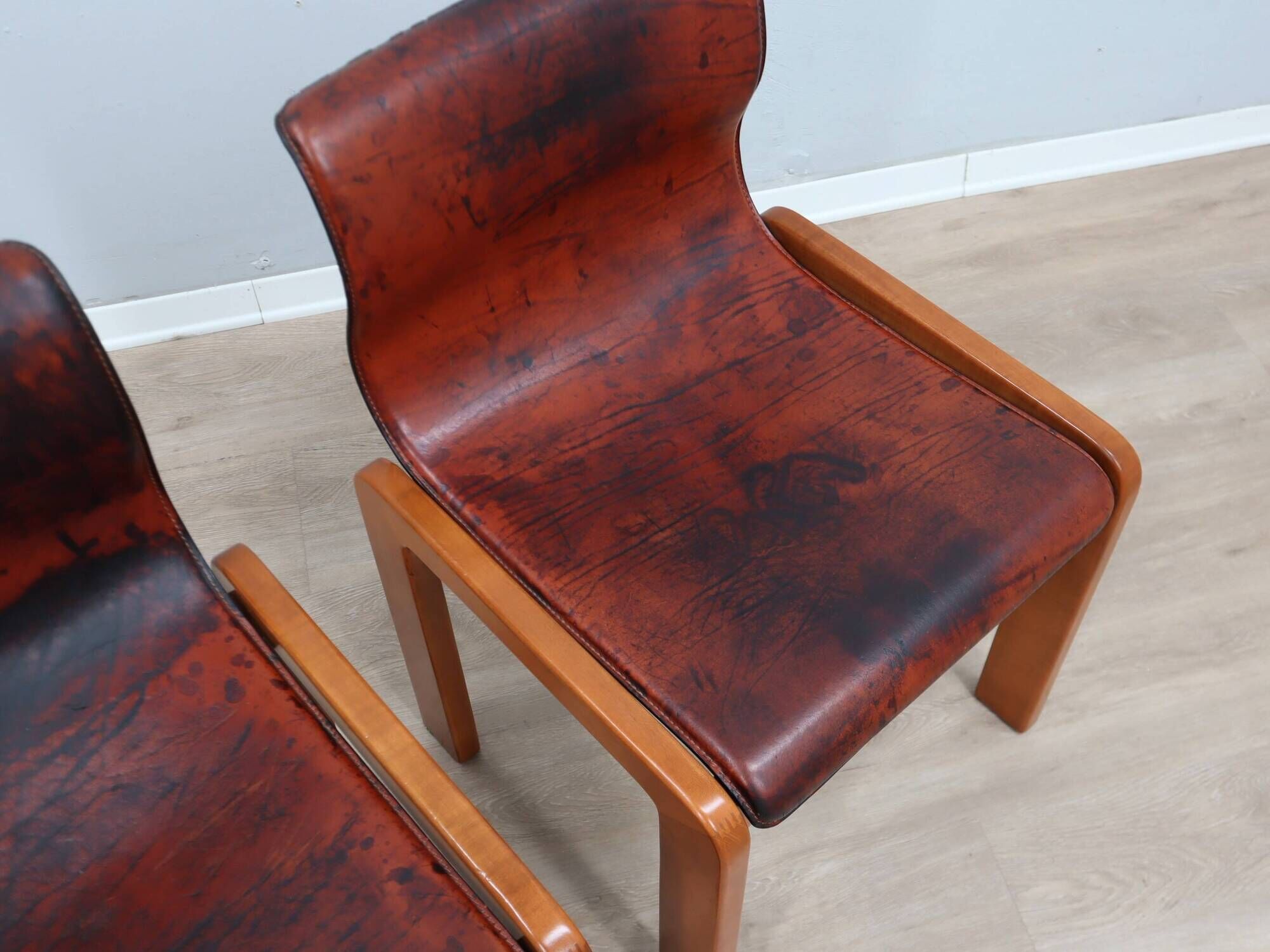 Curved wooden and leather chairs by Afra and Tobia Scarpa from the 1970s, set of 4.