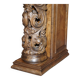 Antique fireplace from around 1880 in solid hand-carved elm with openwork columns.