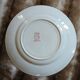 13 mismatched flat plates in ironstone
