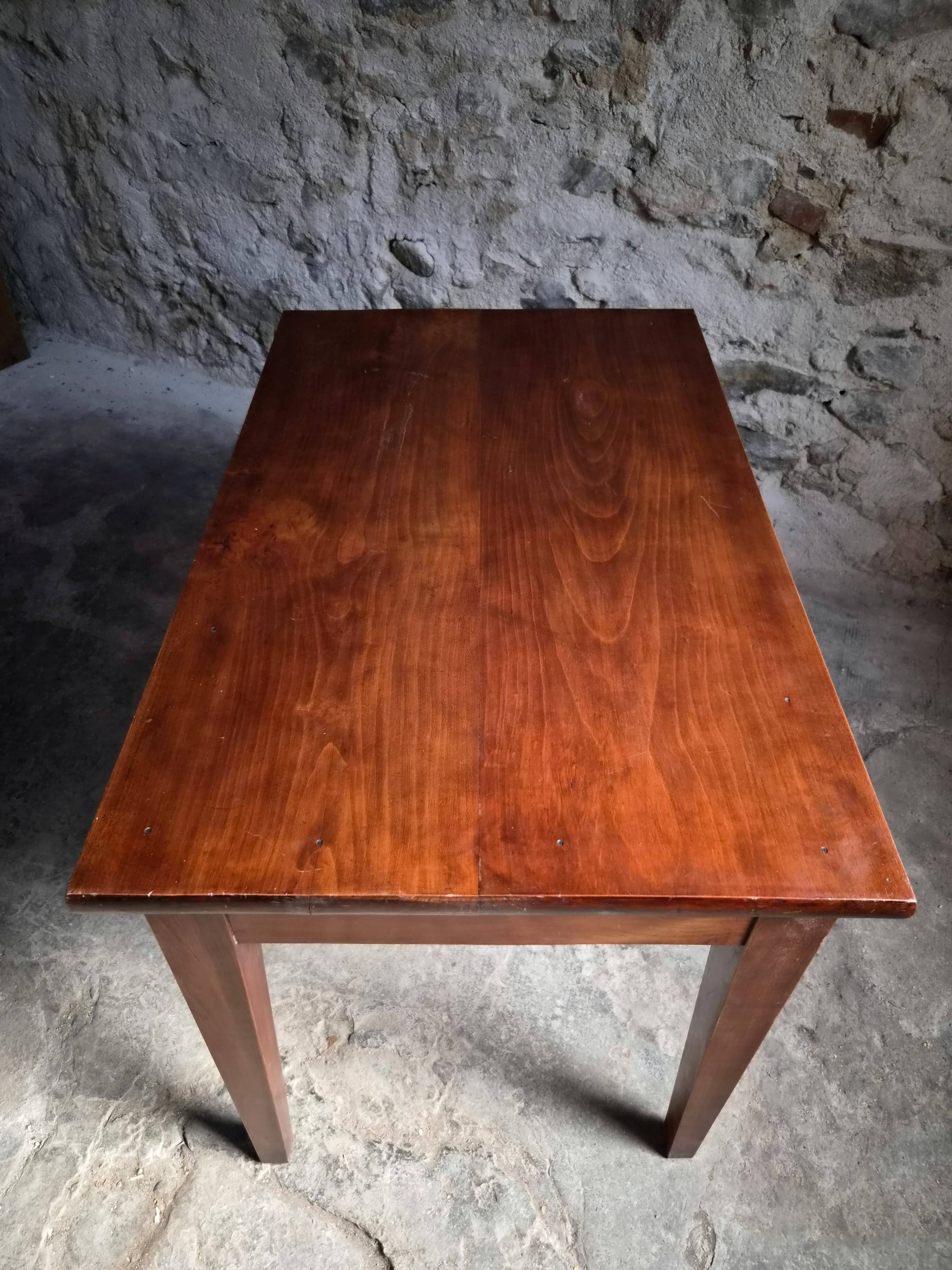 Old French table in cherry wood with bistro chair, circa 1900–1930.