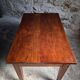 Old French table in cherry wood with bistro chair, circa 1900–1930.