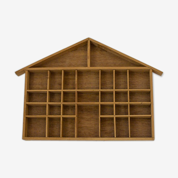 Wooden locker shelf in the shape of a house