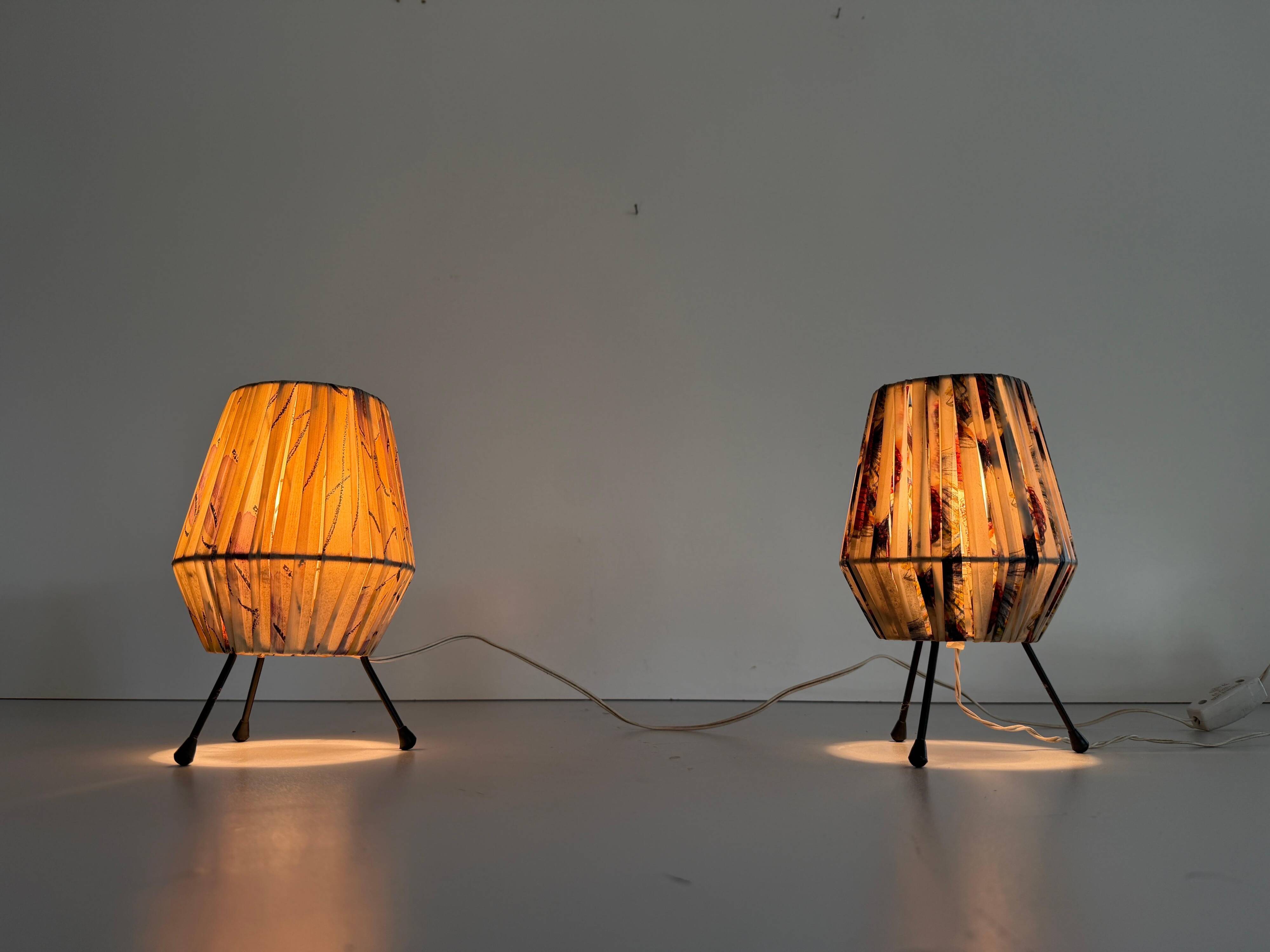 Pair of table lamps with plastic shades and tripod base, 1960s, Italy
