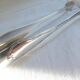 Christofle Silver-plated metal sugar tongs with crossed ribbon bow design