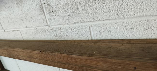 Old oak shelf back of glass counter wall