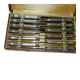 Coffret de 12 couteaux en métal argenté