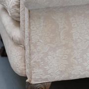 Victorian suite in damask, walnut frame, legs carved in lion's paw.