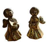 Pair of brass cherub candle holders