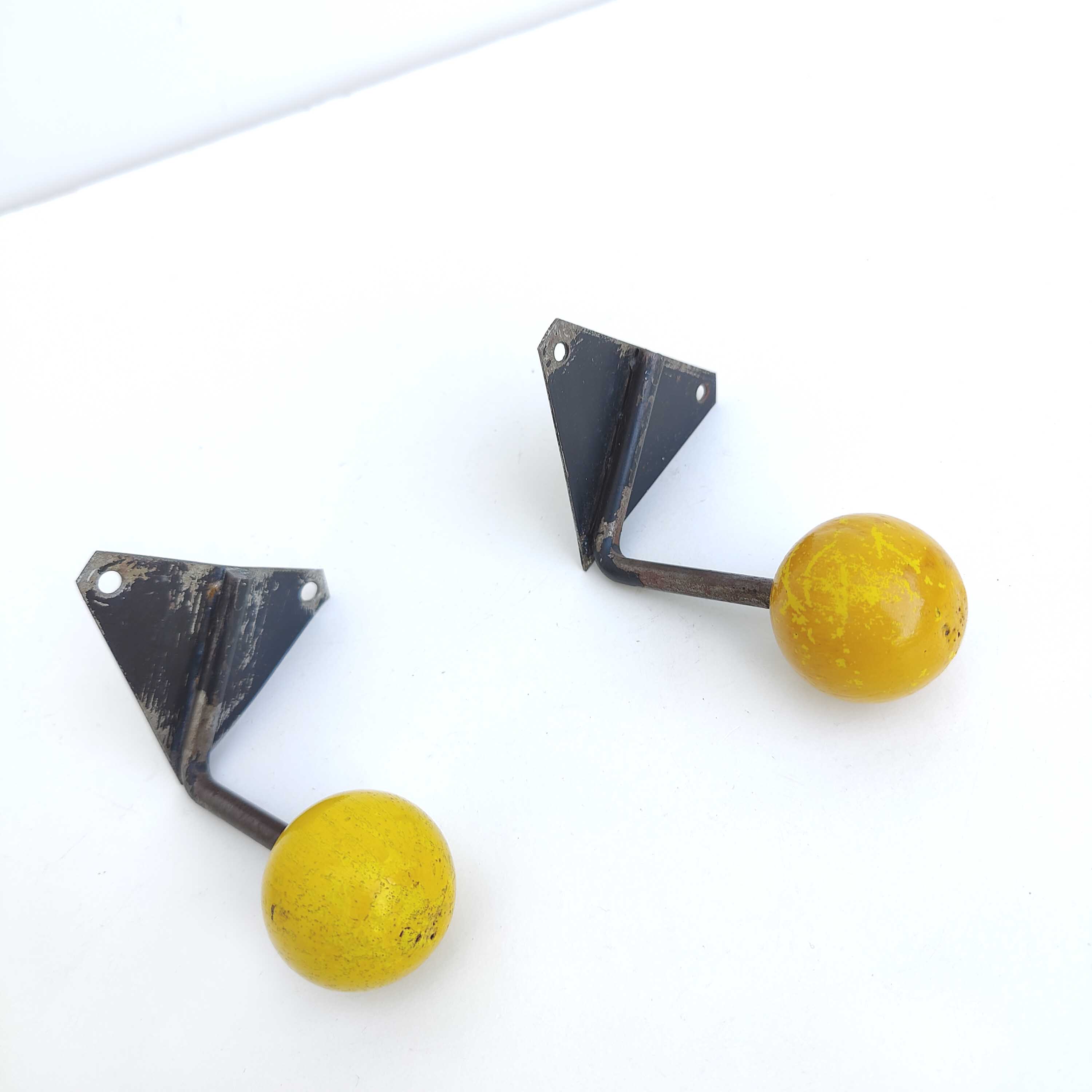Two coat racks hooks balls yellow wood