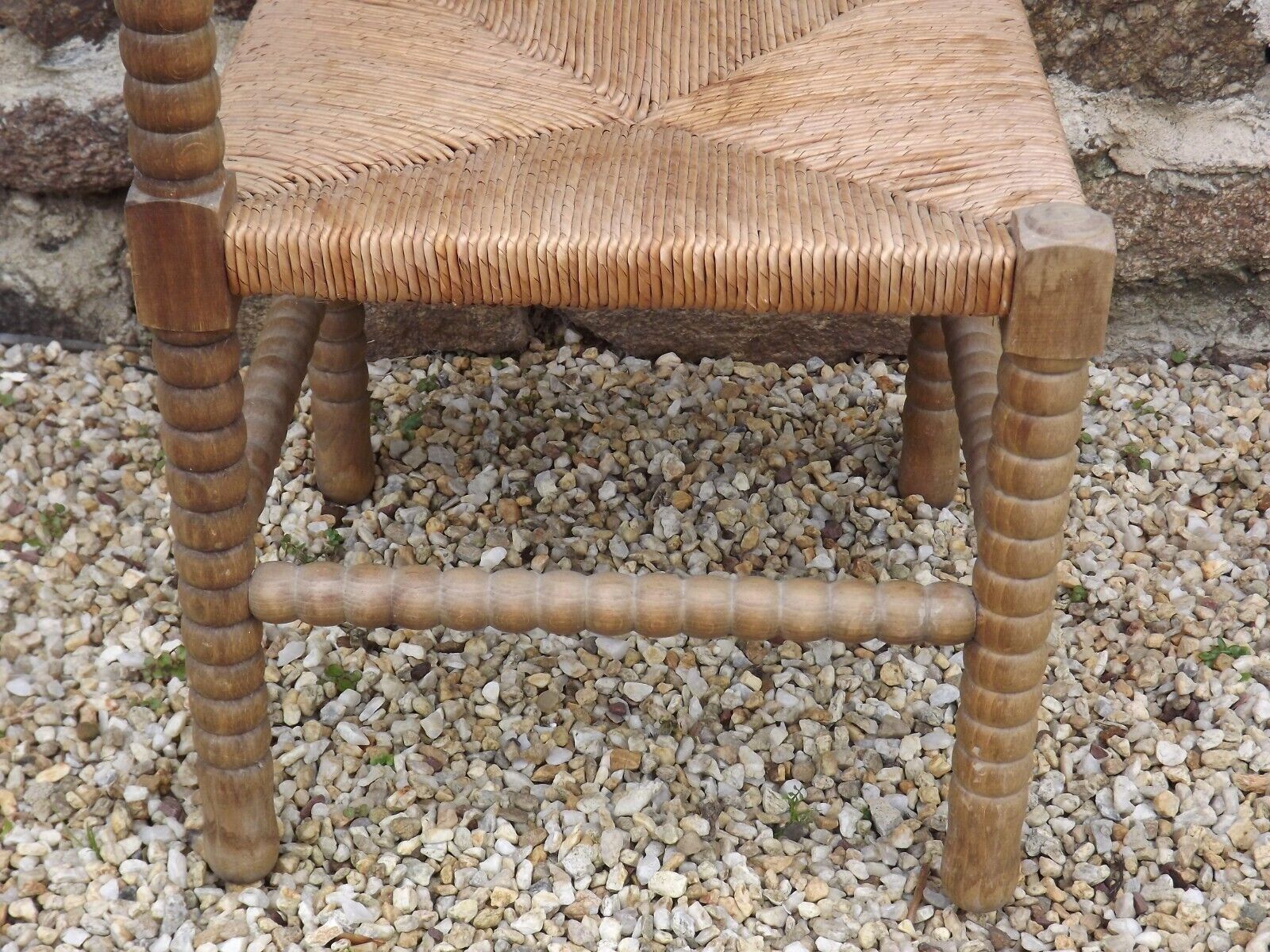 French antique turned wooden bobbin chair with rush seat