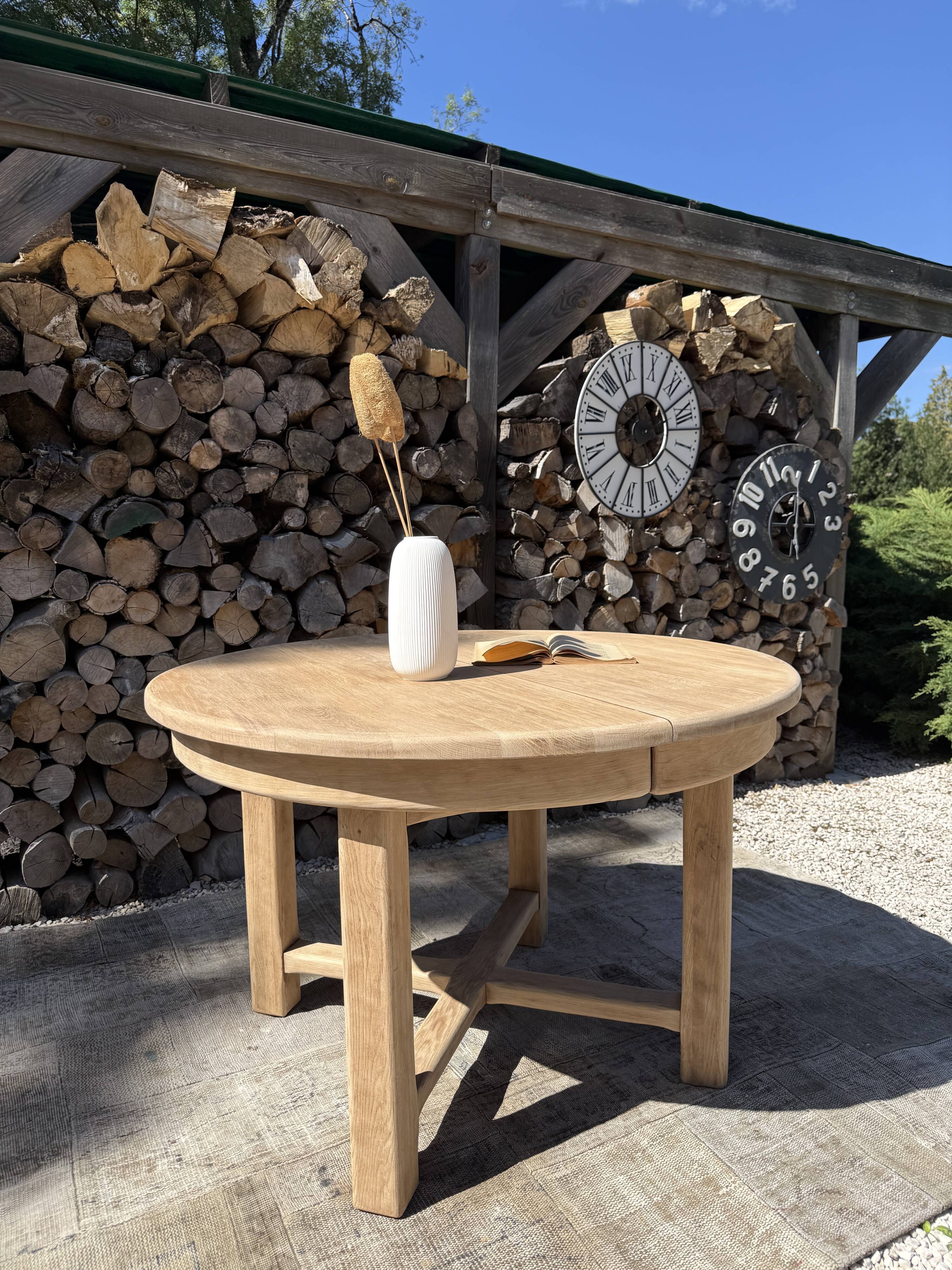 Round solid oak table with extensions, maximum 220cm.