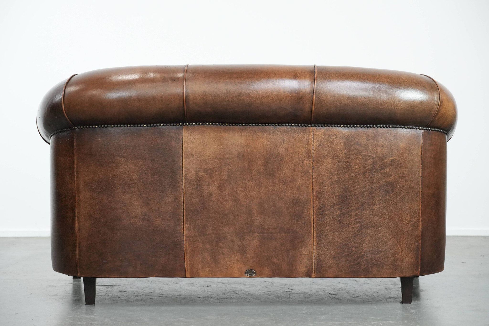 Characterful vintage sturdy 2-seater club sofa made of sheepskin leather