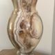 Vintage vase in marbled onyx stone shades of beige and brown