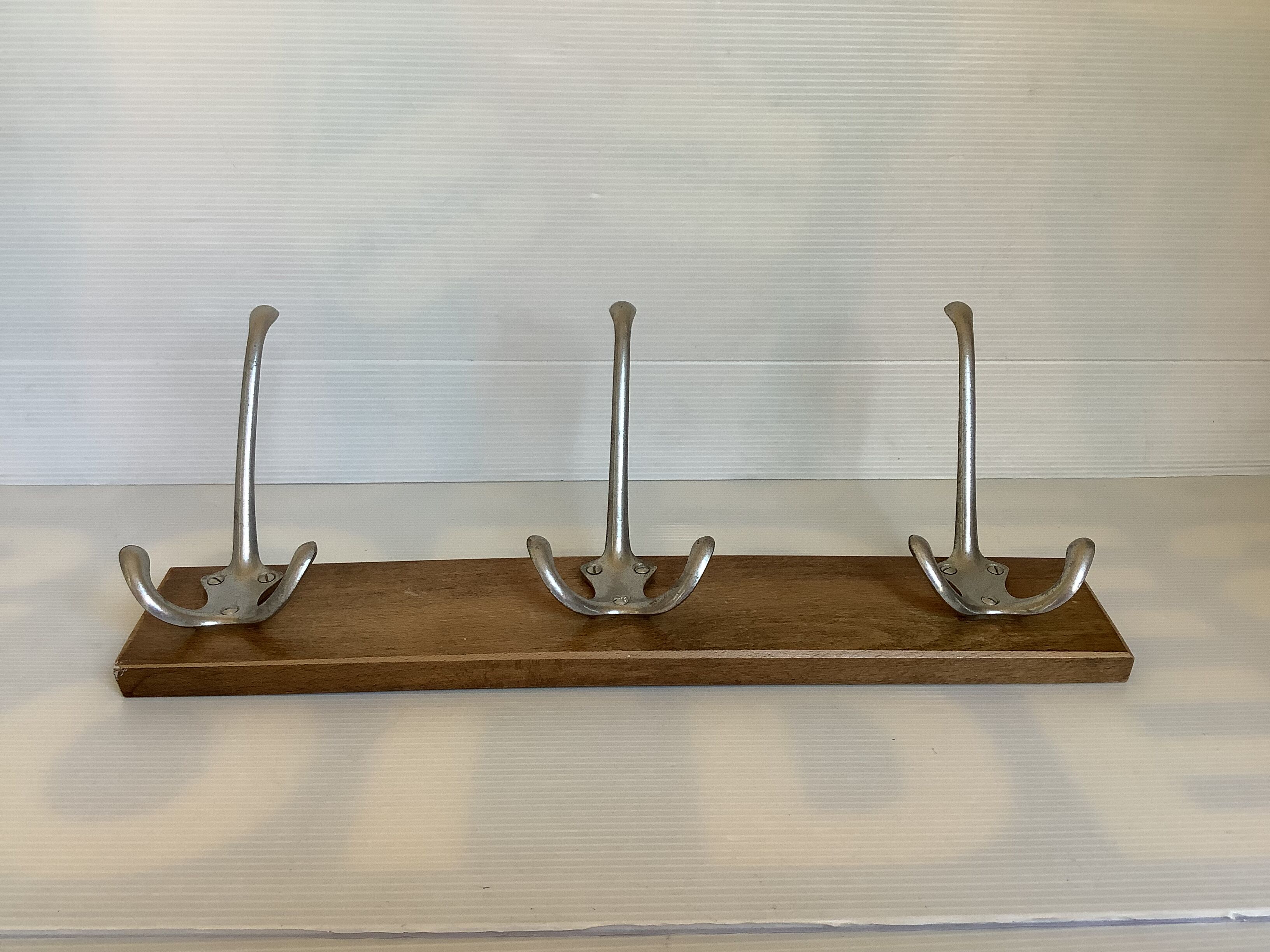 Old coat rack wood metal three hooks