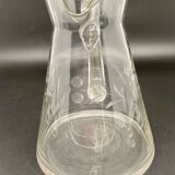 Glass and carafe set with chiseled flower motif