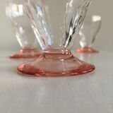 Lot of water in white and pink glass glasses