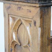 Antique oak church bench in Gothic style with beautiful wood carving