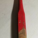Red ribbon wooden badminton racket