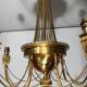 Neoclassical style brass chandelier decorated with pearl garlands