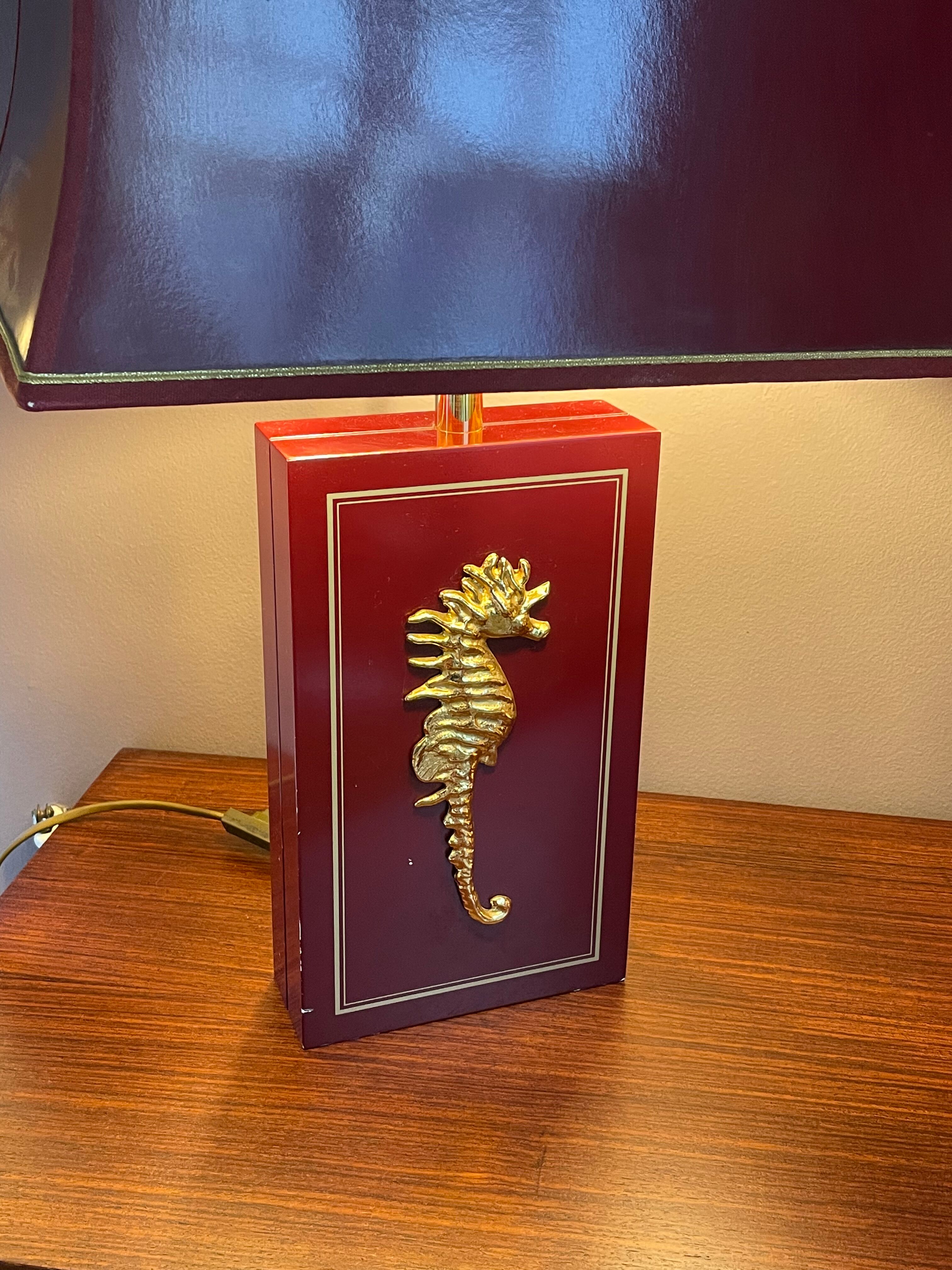 Pair of table lamps in Bordeaux lacquered wood and brass seahorse