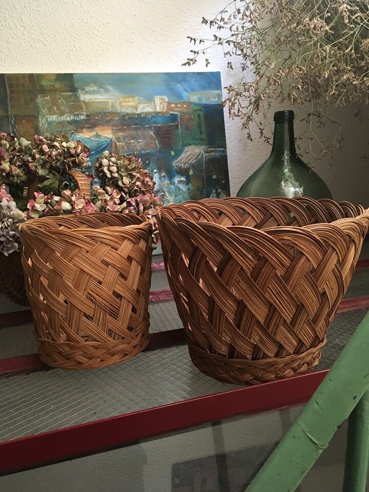 Two matching wicker pot covers