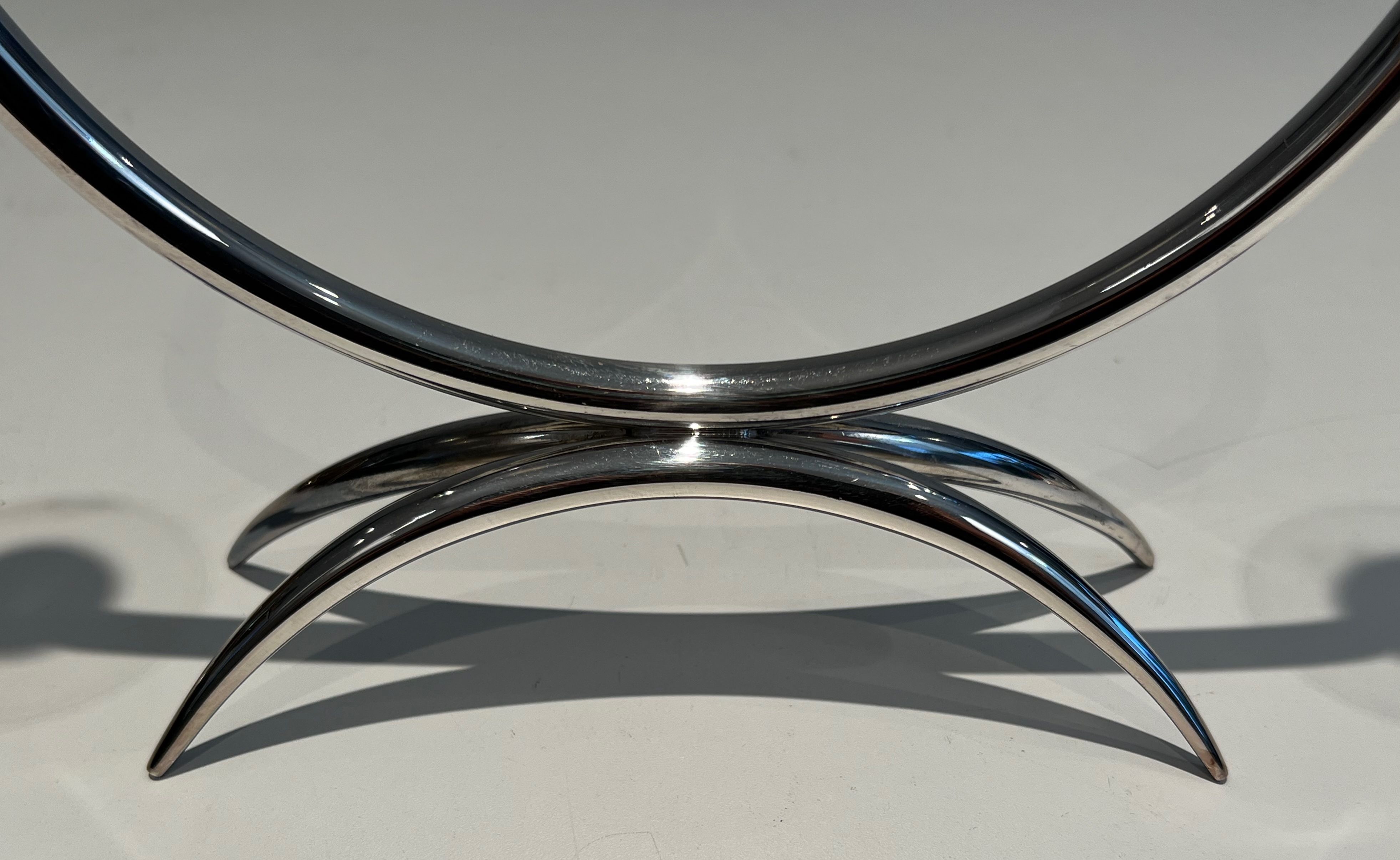 Silver-plated metal and plexiglass design candlestick.