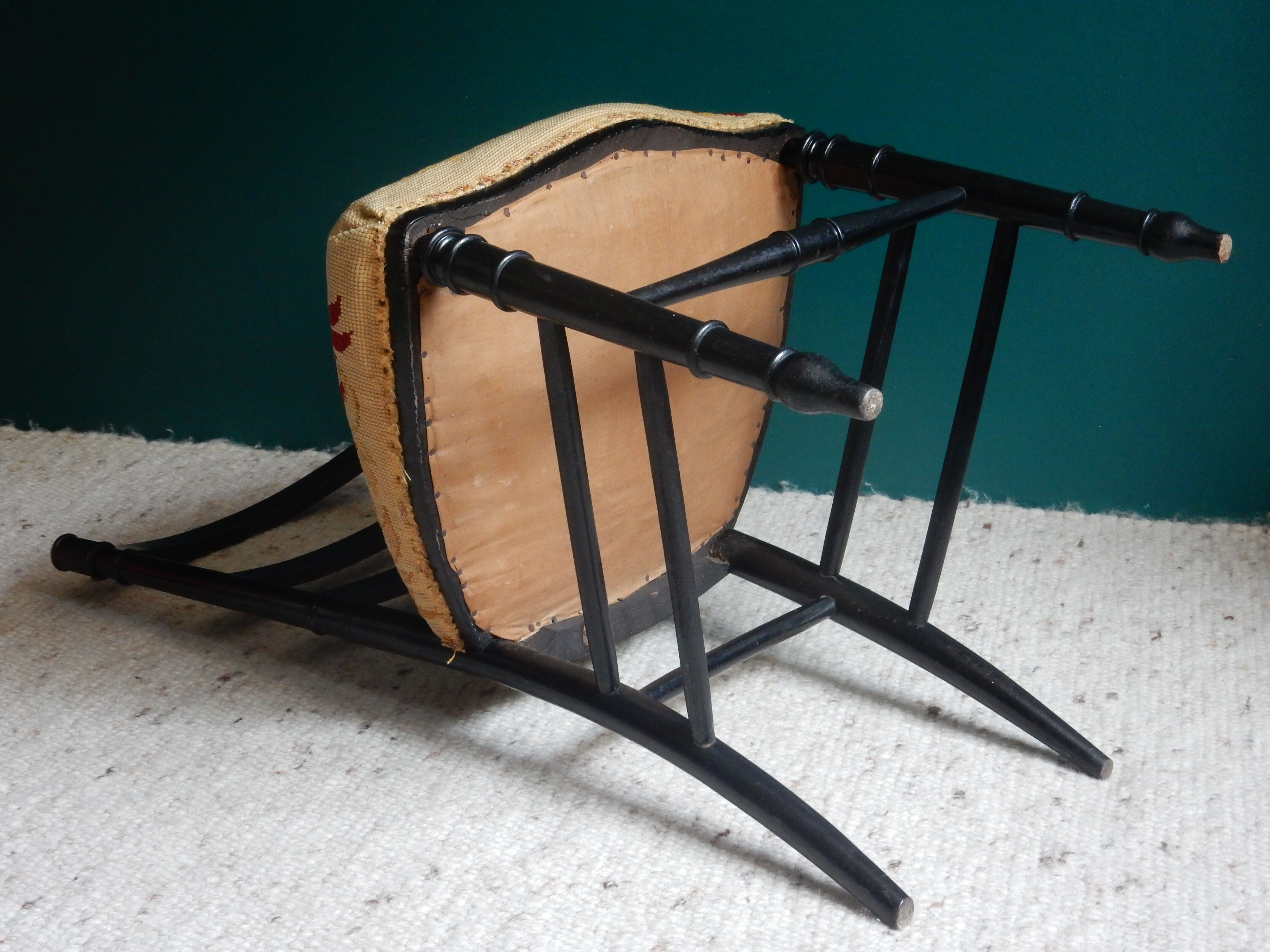 Black Napoleon III chair lined with phoenix