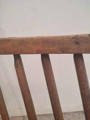 Rocking brutalist chair in oak, France, 1920s