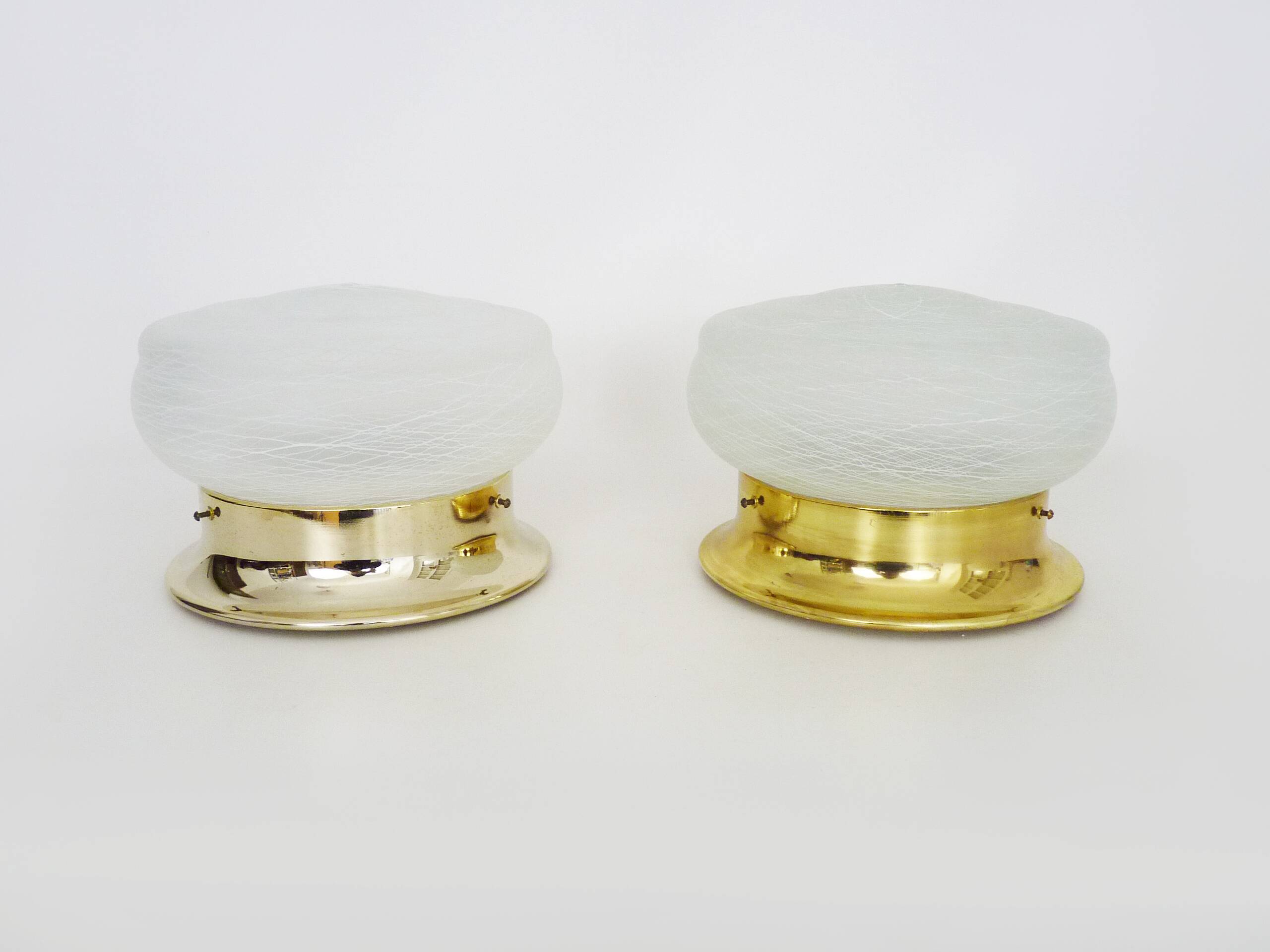 Pair of wall or ceiling lights with white-edged globe. 80 years