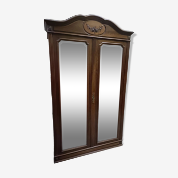 Classic antique wardrobe with beveled mirror doors