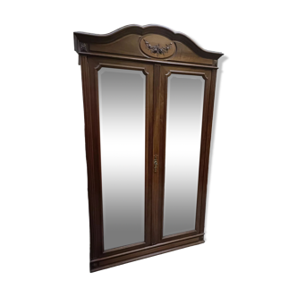 Classic antique wardrobe with beveled mirror doors