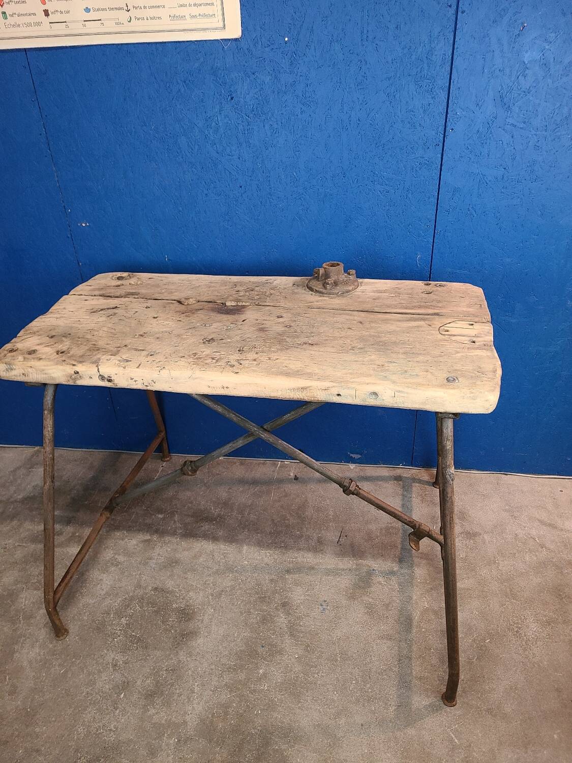 Vintage workbench circa 1930, folding metal leg.