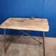 Vintage workbench circa 1930, folding metal leg.