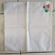 Large white map with colored flower insertion and embroidery.