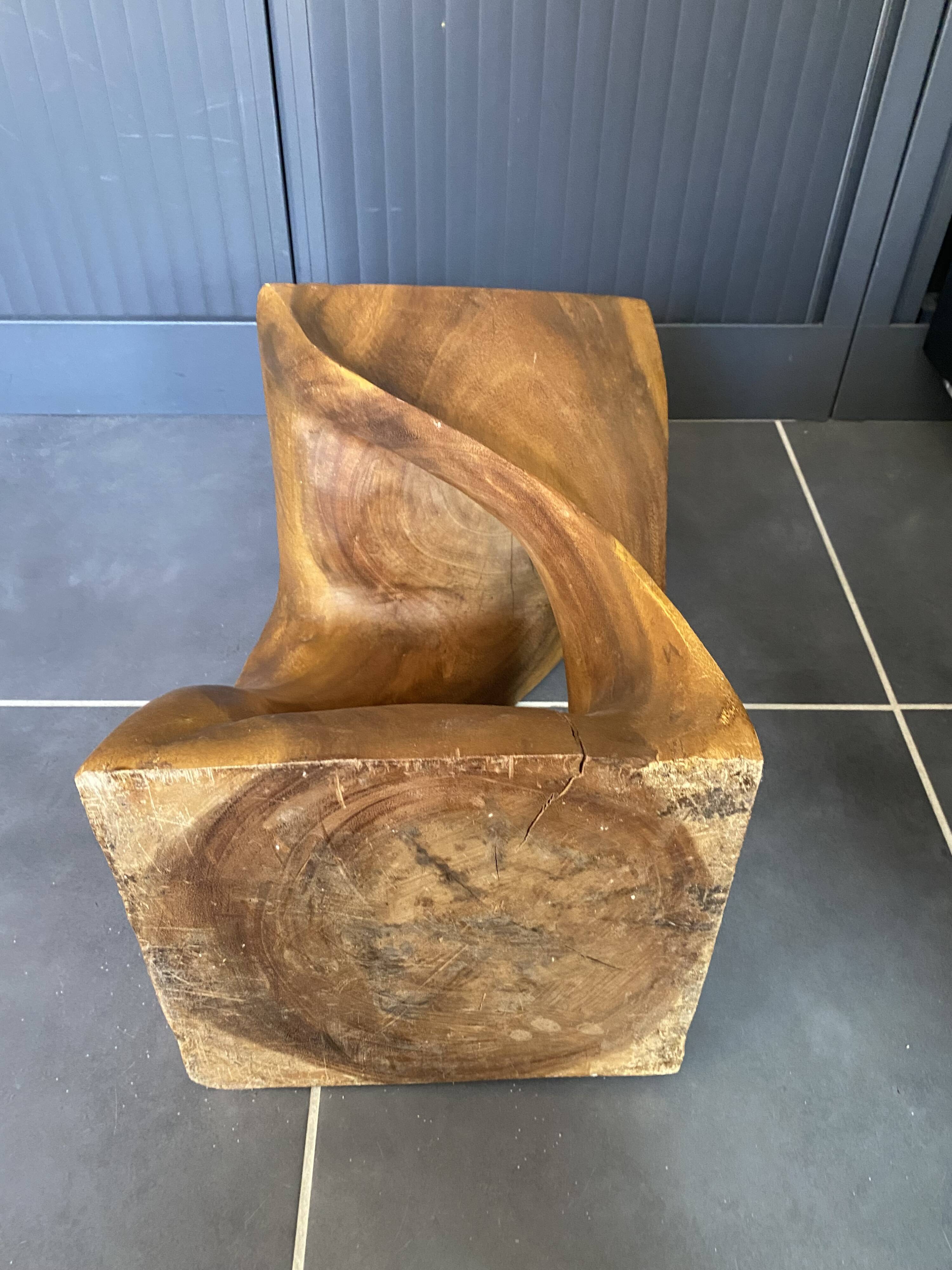 Stool no. 1 in solid raw walnut wood, carved from the mass, 1970.