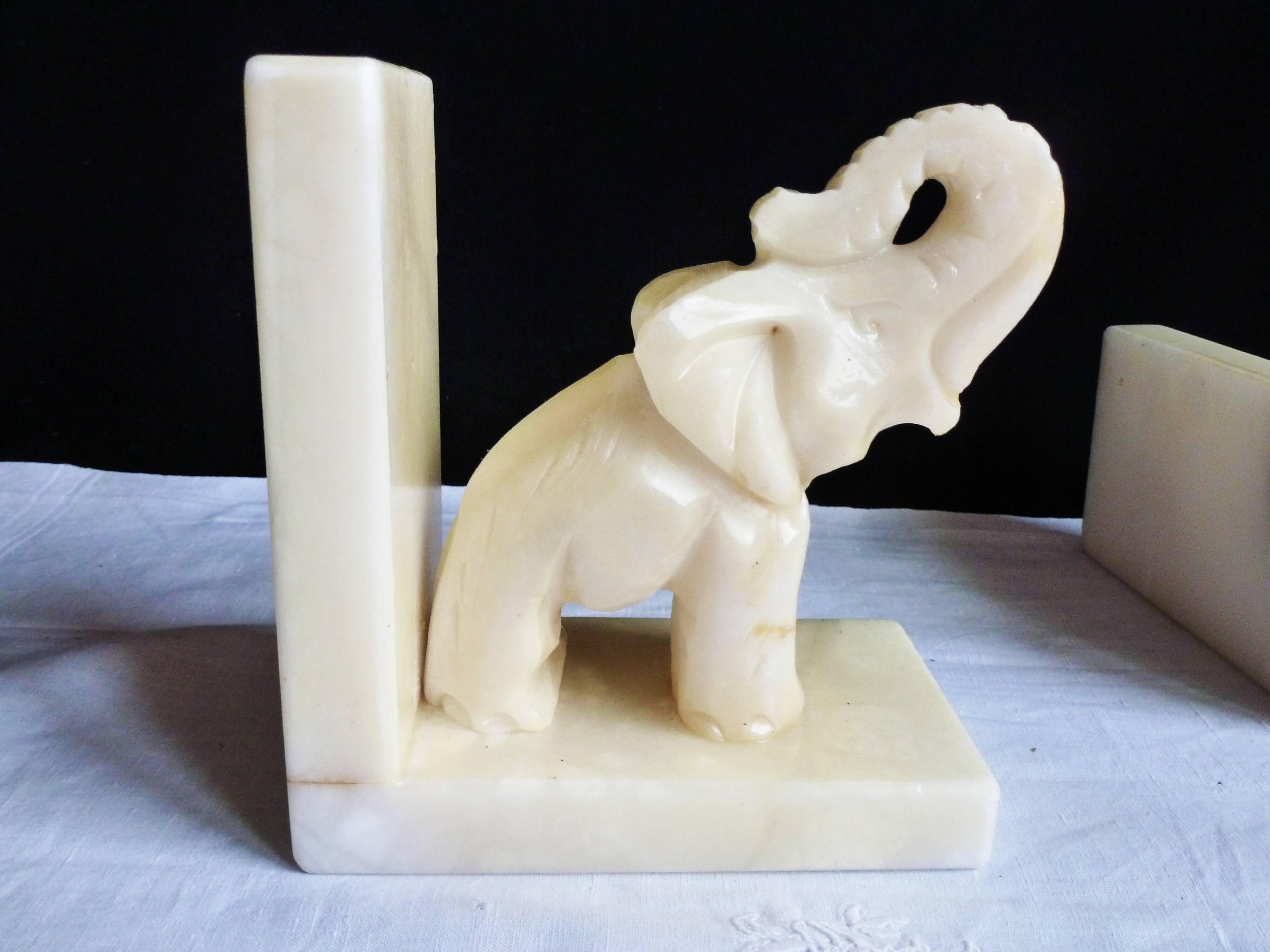 Elephant bookends in alabaster, Pair of elephant bookends.