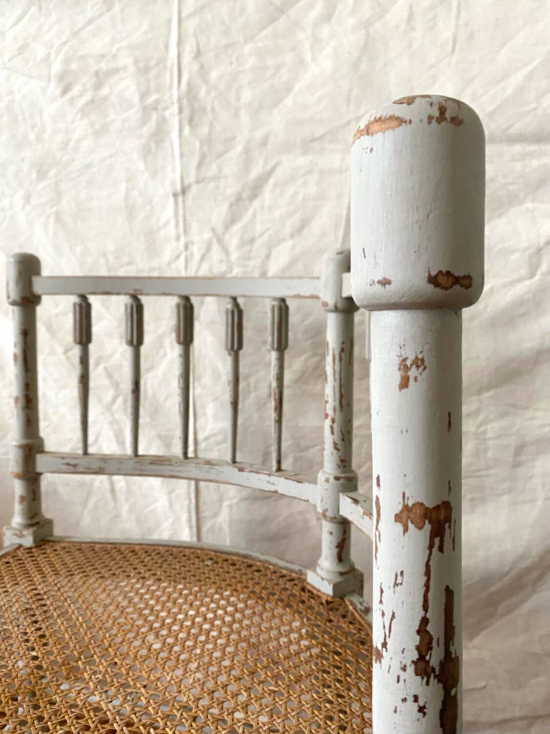 19th-century corner fireplace armchair, wood and cane.