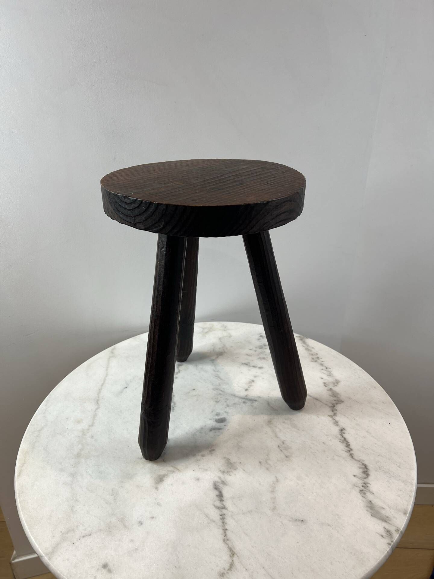 Tripod stool in turned, patinated wood