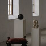 Dark red upholstered camel saddle stool, 20th century, North Africa.