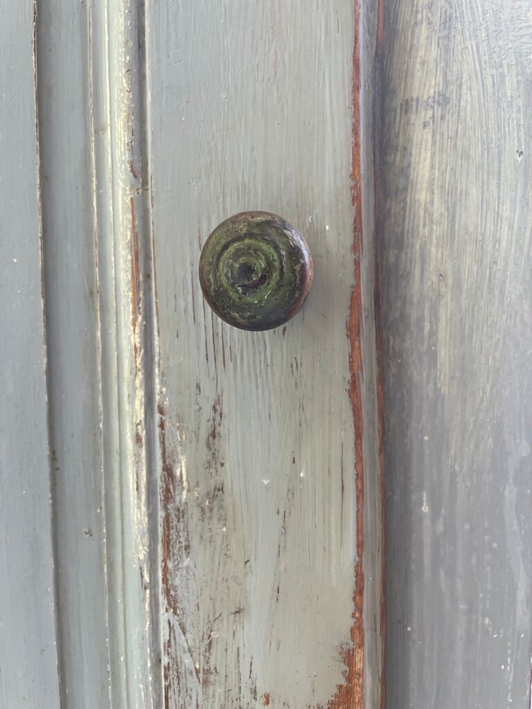 Blue patinated cap cabinet