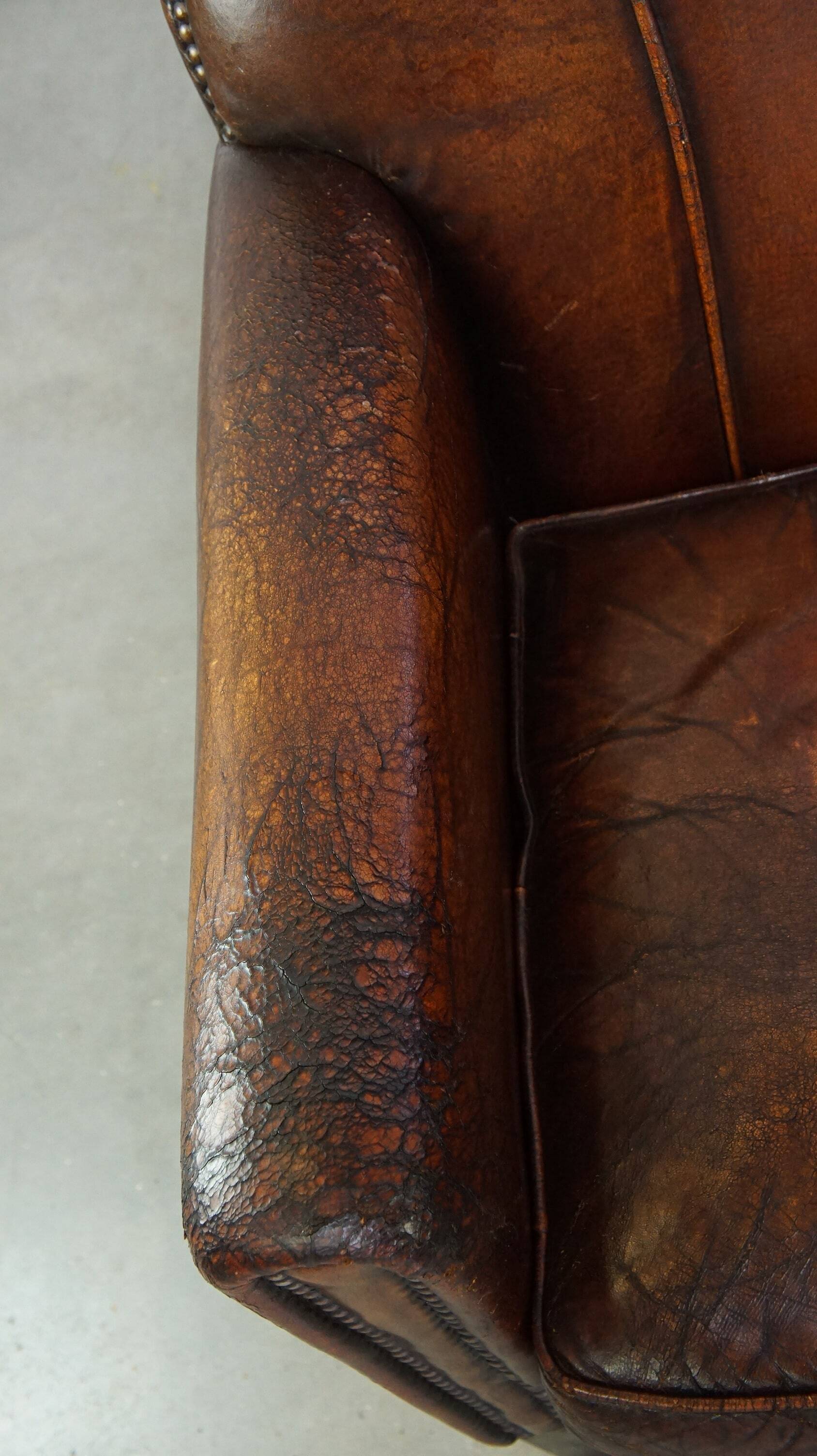 A vintage-style armchair with character, upholstered in beautifully patinated sheepskin.